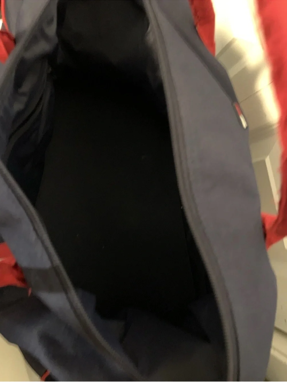Tommy Hilfiger Navy Duffel with Red Piping and Branded Strap